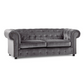 Gray velvet sofa with buttoned backrest on a white background